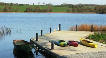 Kayaks and boat on private Lake at Mount Cashel Lodge